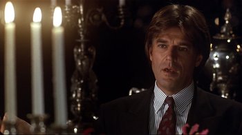 Movie still from “The Prince of Tides” (1991), directed by Barbra Streisand – A person wearing a suit and tie; Close Up shot, Over the shoulder angle
