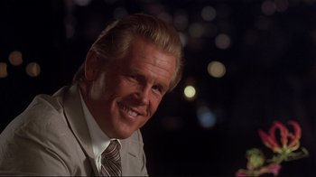 Movie still from “The Prince of Tides” (1991), directed by Barbra Streisand – A person wearing a suit and tie; Close Up shot, Low angle