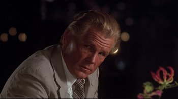 Movie still from “The Prince of Tides” (1991), directed by Barbra Streisand – A person wearing a suit and tie; Close Up shot, Low angle