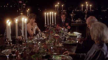 Movie still from “The Prince of Tides” (1991), directed by Barbra Streisand – A group of people sitting around a dinner table; Medium shot, High angle
