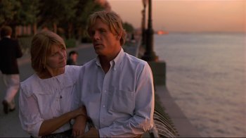 Movie still from “The Prince of Tides” (1991), directed by Barbra Streisand – A man and a woman standing next to each other near a body of water; Medium shot, Low angle
