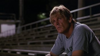 Movie still from “The Prince of Tides” (1991), directed by Barbra Streisand – A person sitting on a bench at night; Close Up shot, Low angle