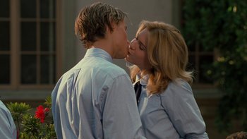 Movie still from “The Princess Diaries” (2001), directed by Garry Marshall – A man and a woman kissing each other on the lips; Medium shot, Low angle
