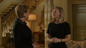 Movie still from “The Princess Diaries” (2001), directed by Garry Marshall – Two women are conversing in an elegant room; Medium shot, Over the shoulder angle