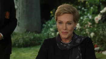 Movie still from “The Princess Diaries” (2001), directed by Garry Marshall – A person with short blonde hair; Close Up shot, Over the shoulder angle