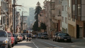 Movie still from “The Princess Diaries” (2001), directed by Garry Marshall – A group of people walking down a street; Extreme Wide shot, High angle