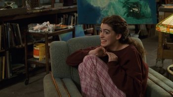 Movie still from “The Princess Diaries” (2001), directed by Garry Marshall – A woman sitting on a couch in a living room; Medium shot, High angle