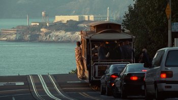 Movie still from “The Princess Diaries” (2001), directed by Garry Marshall – A man standing next to a train on the tracks; Extreme Wide shot, Low angle