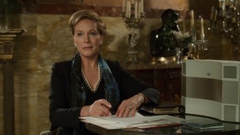 Movie still from “The Princess Diaries” (2001), directed by Garry Marshall – A woman sitting at a table writing on a piece of paper; Medium shot, Over the shoulder angle