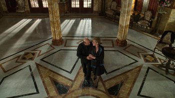 Movie still from “The Princess Diaries” (2001), directed by Garry Marshall – A man and a woman are standing in an ornate room; Wide shot, Overhead angle
