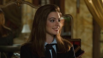 Movie still from “The Princess Diaries” (2001), directed by Garry Marshall – A woman with long hair wearing a suit and tie; Close Up shot, Over the shoulder angle