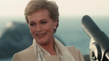 Movie still from “The Princess Diaries” (2001), directed by Garry Marshall – A person wearing a suit and tie; Close Up shot, Over the shoulder angle