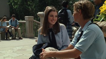 Movie still from “The Princess Diaries” (2001), directed by Garry Marshall – A young woman sitting next to a young man on a bench; Medium shot, Over the shoulder angle