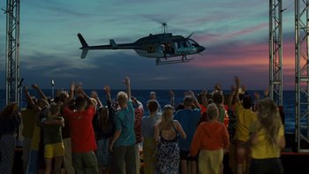 Movie still from “The Princess Diaries” (2001), directed by Garry Marshall – A crowd of people watching a helicopter flying over the ocean; Extreme Wide shot, High angle