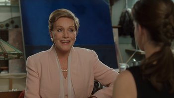 Movie still from “The Princess Diaries” (2001), directed by Garry Marshall – A woman in a pink jacket is talking to someone; Medium shot, Over the shoulder angle