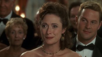 Movie still from “The Princess Diaries” (2001), directed by Garry Marshall – A person wearing a necklace; Close Up shot, Over the shoulder angle