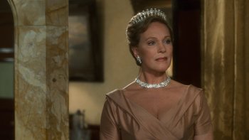Movie still from “The Princess Diaries” (2001), directed by Garry Marshall – A woman wearing a tiara in a room; Close Up shot, Over the shoulder angle