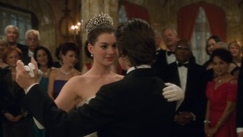 Movie still from “The Princess Diaries” (2001), directed by Garry Marshall – A man and a woman dancing in formal wear; Medium shot, Over the shoulder angle