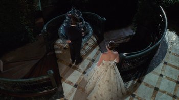 Movie still from “The Princess Diaries” (2001), directed by Garry Marshall – A man and a woman standing on a staircase; Wide shot, Overhead angle
