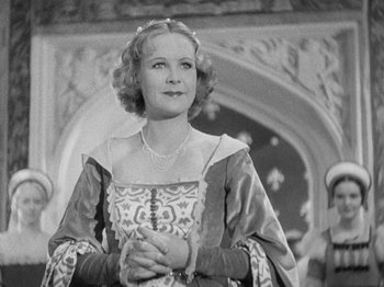 Movie still from “The Private Life of Henry VIII” (1933), directed by Alexander Korda – An old photo of a woman in a medieval dress; Medium shot, Low angle