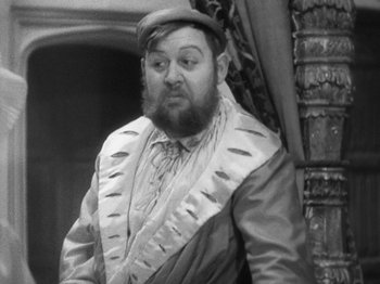Movie still from “The Private Life of Henry VIII” (1933), directed by Alexander Korda – A man with a beard wearing a hat and a jacket; Close Up shot, High angle