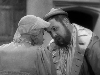 Movie still from “The Private Life of Henry VIII” (1933), directed by Alexander Korda – A man and a woman are talking to each other; Close Up shot, Over the shoulder angle
