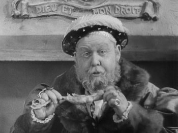 Movie still from “The Private Life of Henry VIII” (1933), directed by Alexander Korda – An old man wearing a fur coat holding a spoon; Close Up shot, High angle