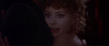 Movie still from “The Private Life of Sherlock Holmes” (1970), directed by Billy Wilder – A woman's face in a dark room; Close Up shot, Over the shoulder angle