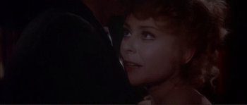 Movie still from “The Private Life of Sherlock Holmes” (1970), directed by Billy Wilder – A woman's face with a man's arm around it; Close Up shot, Over the shoulder angle