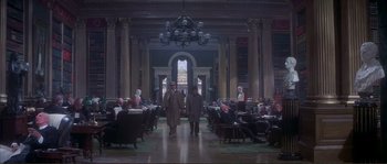 Movie still from “The Private Life of Sherlock Holmes” (1970), directed by Billy Wilder – Two men are walking through a lobby of a building; Extreme Wide shot, High angle