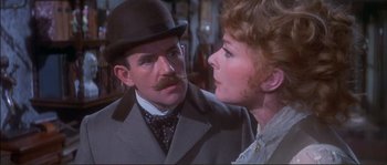 Movie still from “The Private Life of Sherlock Holmes” (1970), directed by Billy Wilder – A man and a woman are looking at one another; Close Up shot, Over the shoulder angle