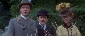 A group of men standing next to each other in a field