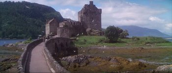 Movie still from “The Private Life of Sherlock Holmes” (1970), directed by Billy Wilder – A castle with a bird flying over it; Extreme Wide shot, Low angle