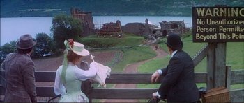 Movie still from “The Private Life of Sherlock Holmes” (1970), directed by Billy Wilder – A man and a woman sitting on a bench; Extreme Wide shot, High angle
