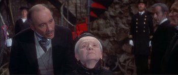 Movie still from “The Private Life of Sherlock Holmes” (1970), directed by Billy Wilder – An old woman with a black hat and a black suit; Close Up shot, High angle