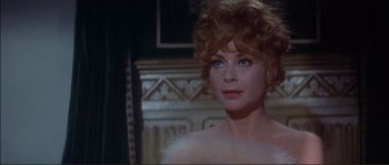 Movie still from “The Private Life of Sherlock Holmes” (1970), directed by Billy Wilder – A person wearing a dress; Close Up shot, Over the shoulder angle