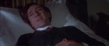 Movie still from “The Private Life of Sherlock Holmes” (1970), directed by Billy Wilder – A man laying in a bed with a white pillow; Close Up shot, High angle