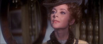 Movie still from “The Private Life of Sherlock Holmes” (1970), directed by Billy Wilder – A person wearing a hat and looking into a mirror; Close Up shot, Over the shoulder angle