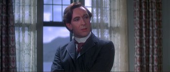 Movie still from “The Private Life of Sherlock Holmes” (1970), directed by Billy Wilder – A person wearing a suit and tie; Close Up shot, Low angle