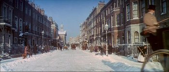 Movie still from “The Private Life of Sherlock Holmes” (1970), directed by Billy Wilder – Horse drawn carriages traveling down a snow covered street; Extreme Wide shot, High angle