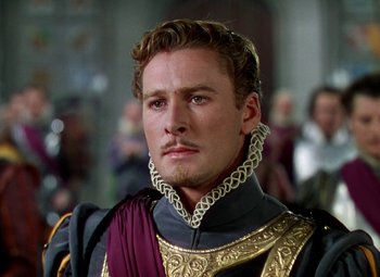 Movie still from “The Private Lives of Elizabeth and Essex” (1939), directed by Michael Curtiz – A person wearing a costume; Close Up shot, Low angle