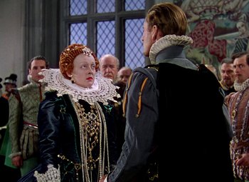 Movie still from “The Private Lives of Elizabeth and Essex” (1939), directed by Michael Curtiz – A man and a woman dressed in renaissance clothing; Medium shot, Over the shoulder angle