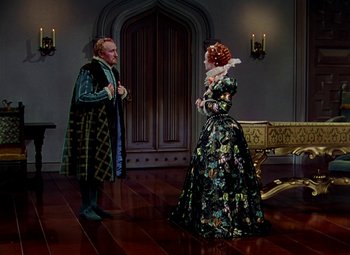 Movie still from “The Private Lives of Elizabeth and Essex” (1939), directed by Michael Curtiz – A man and a woman dressed in medieval clothing; Wide shot, High angle