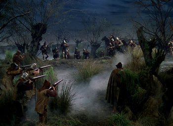 Movie still from “The Private Lives of Elizabeth and Essex” (1939), directed by Michael Curtiz – A group of men are fighting in a field; Wide shot, High angle
