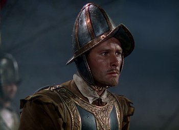 Movie still from “The Private Lives of Elizabeth and Essex” (1939), directed by Michael Curtiz – A person wearing a helmet; Close Up shot, Low angle