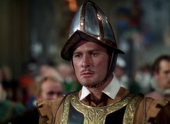 Movie still from “The Private Lives of Elizabeth and Essex” (1939), directed by Michael Curtiz – A person wearing a helmet; Close Up shot, High angle