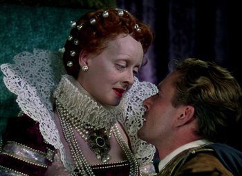 Movie still from “The Private Lives of Elizabeth and Essex” (1939), directed by Michael Curtiz – A man and a woman dressed in renaissance clothing; Close Up shot, Overhead angle