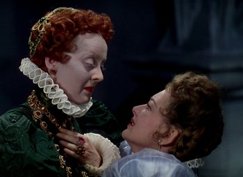 Movie still from “The Private Lives of Elizabeth and Essex” (1939), directed by Michael Curtiz – Two women in a scene from a movie; Close Up shot, Over the shoulder angle