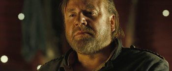 Movie still from “The Proposition” (2005), directed by John Hillcoat – A person with a beard; Close Up shot, Over the shoulder angle