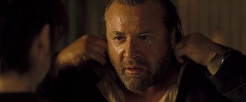 Movie still from “The Proposition” (2005), directed by John Hillcoat – A person with a beard; Close Up shot, Over the shoulder angle